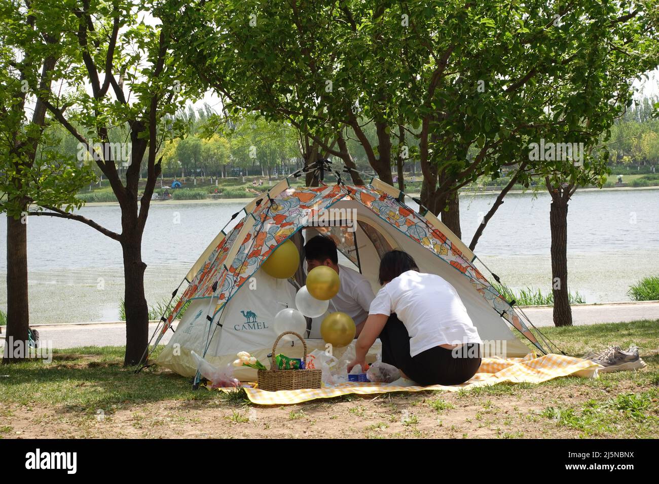Chinese families camp outdoors to enjoy the weekends. Stock Photo
