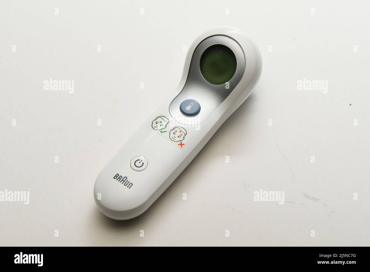 Cut out Touchless non-contact digital thermometer commonly used to measure human body temperature for fever. Stock Photo