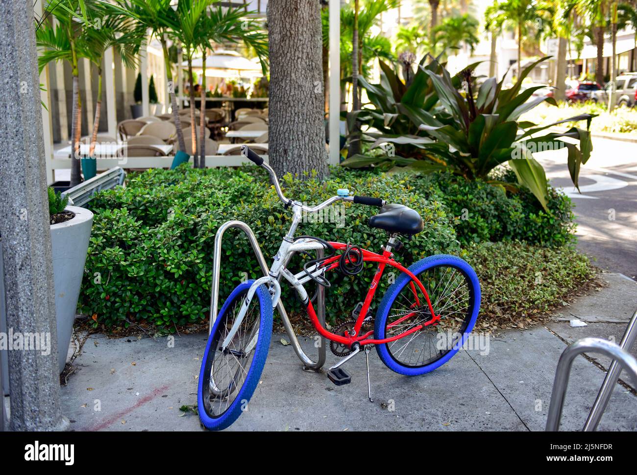 Red White and Blue Bike on the Downtown Streets of St. Petersburg Florida. Stock Photo