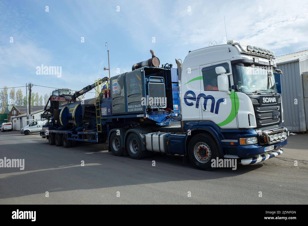An articulated lorry owned by emr a scrap metal dealer the lorry has equipment installed for crushing cars and baling scrap metal Stock Photo