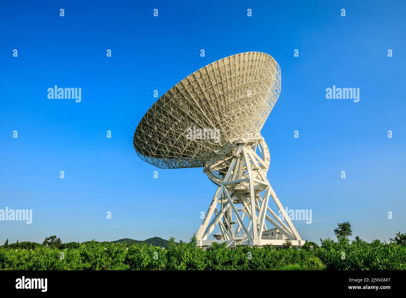 Astronomical radio telescope under blue sky Stock Photo