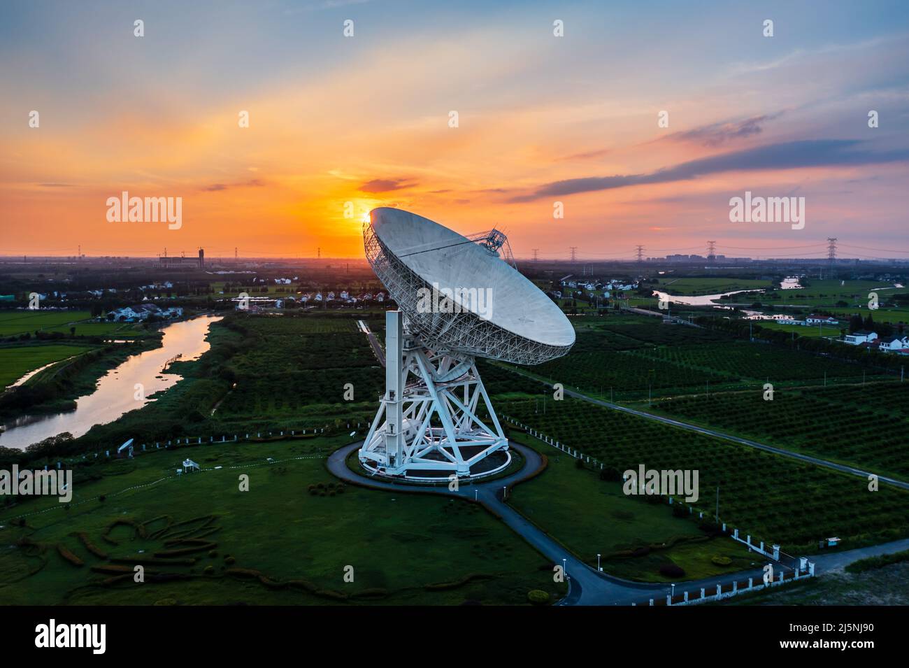Aerial view of astronomical radio telescope at sunset Stock Photo