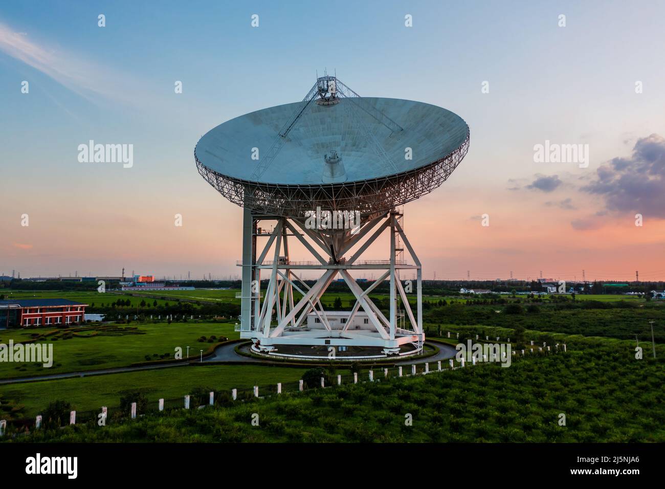 Aerial view of astronomical radio telescope at sunset Stock Photo