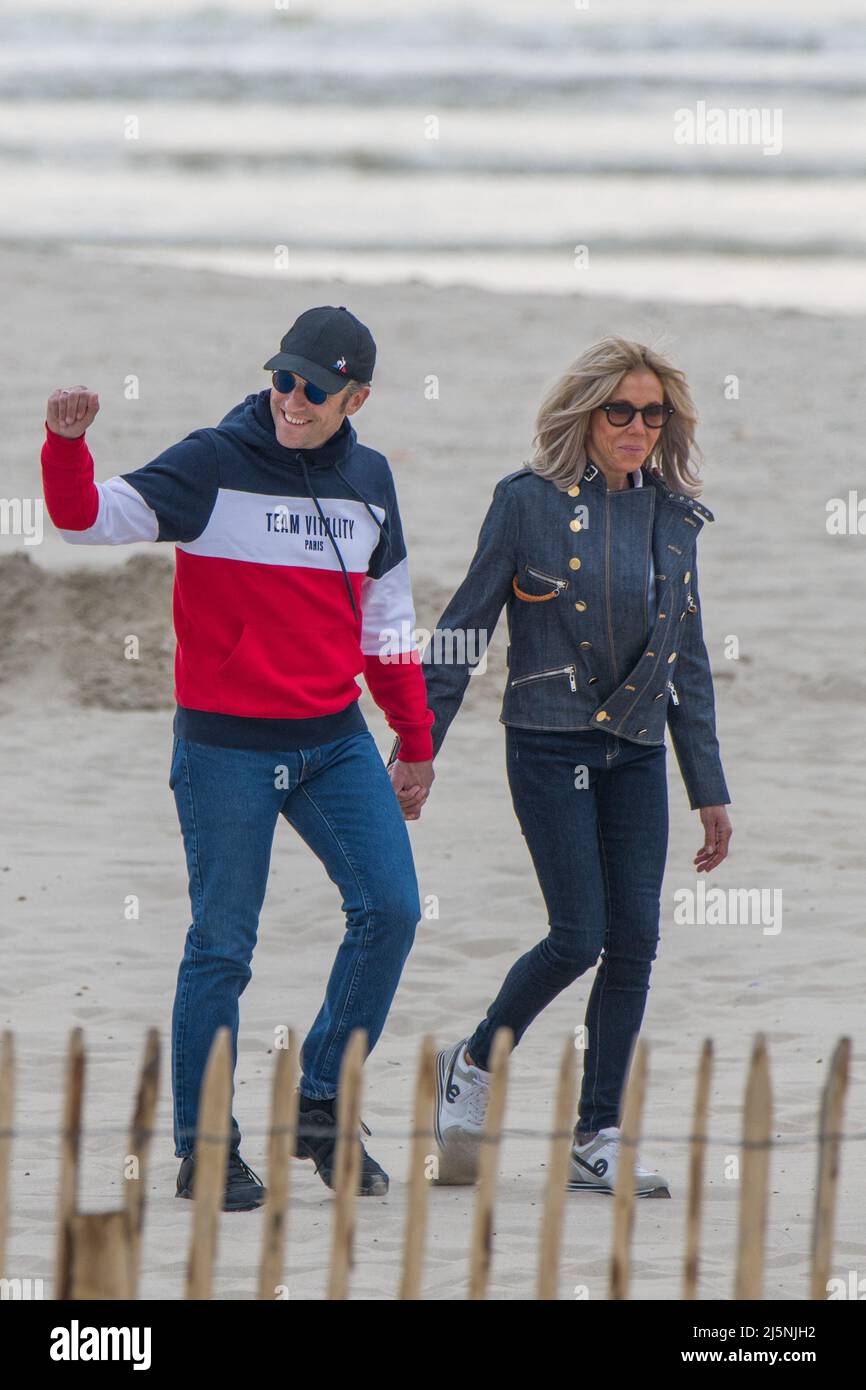 French President Emmanuel Macron and wife Brigitte Macron walking on the  beach one day before the vote in the second round of the French  presidential elections in Le Touquet, North of France