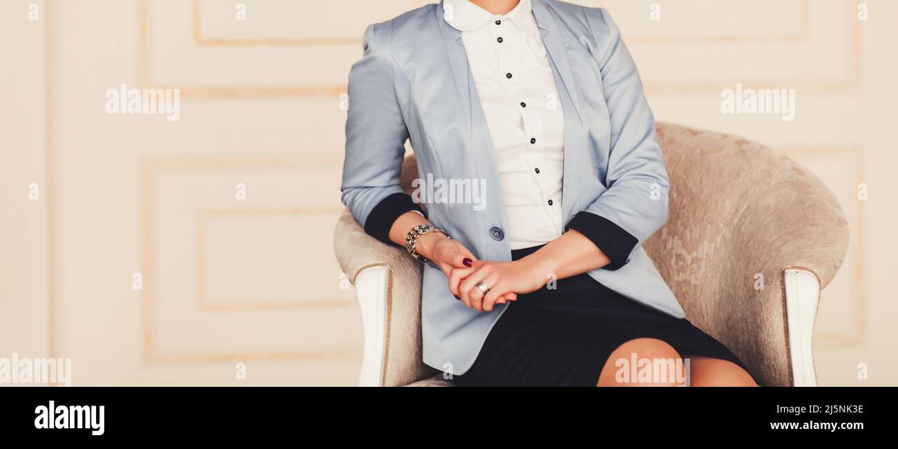 Portrait of a young successful woman sitting in a chair. businesswoman. professional manager Stock Photo
