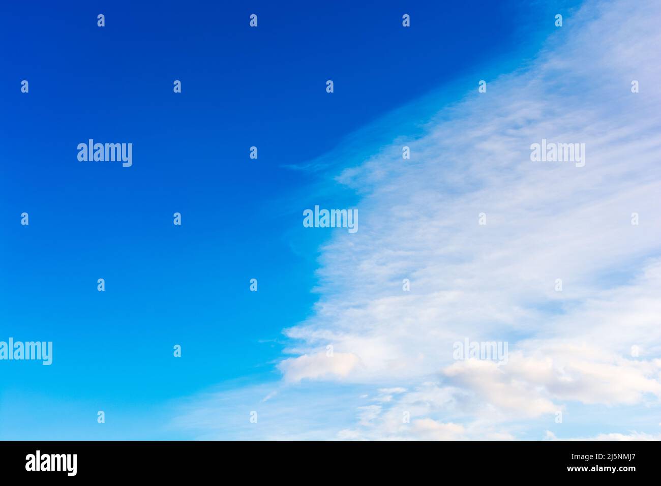 blue sky and white clouds on a windy weather. atmosphere air freedom concept. nature series in spring. creative gradient background for installation a Stock Photo