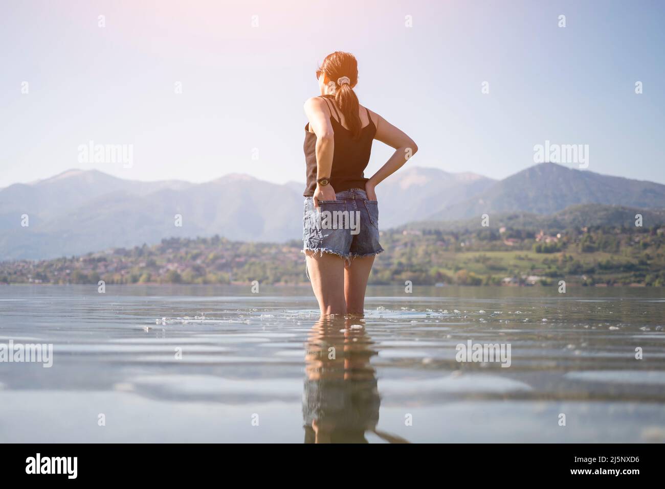 Standing woman in shorts hi-res stock photography and images - Alamy