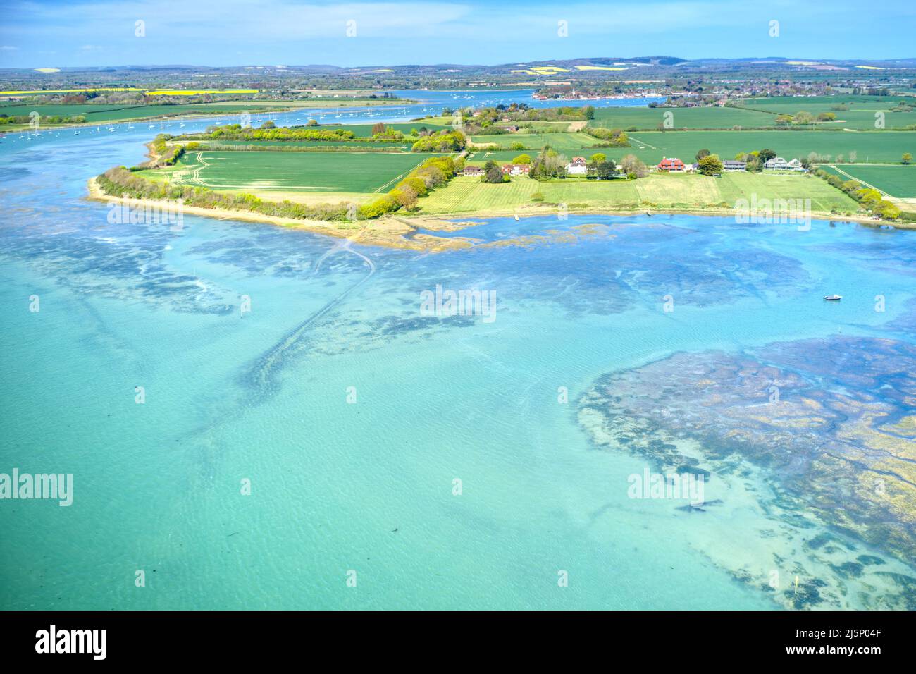 Aerial photo over estuary near Itchenor in Chichester Harbour  in the  beautiful countryside of West Sussex in Southern England. Stock Photo