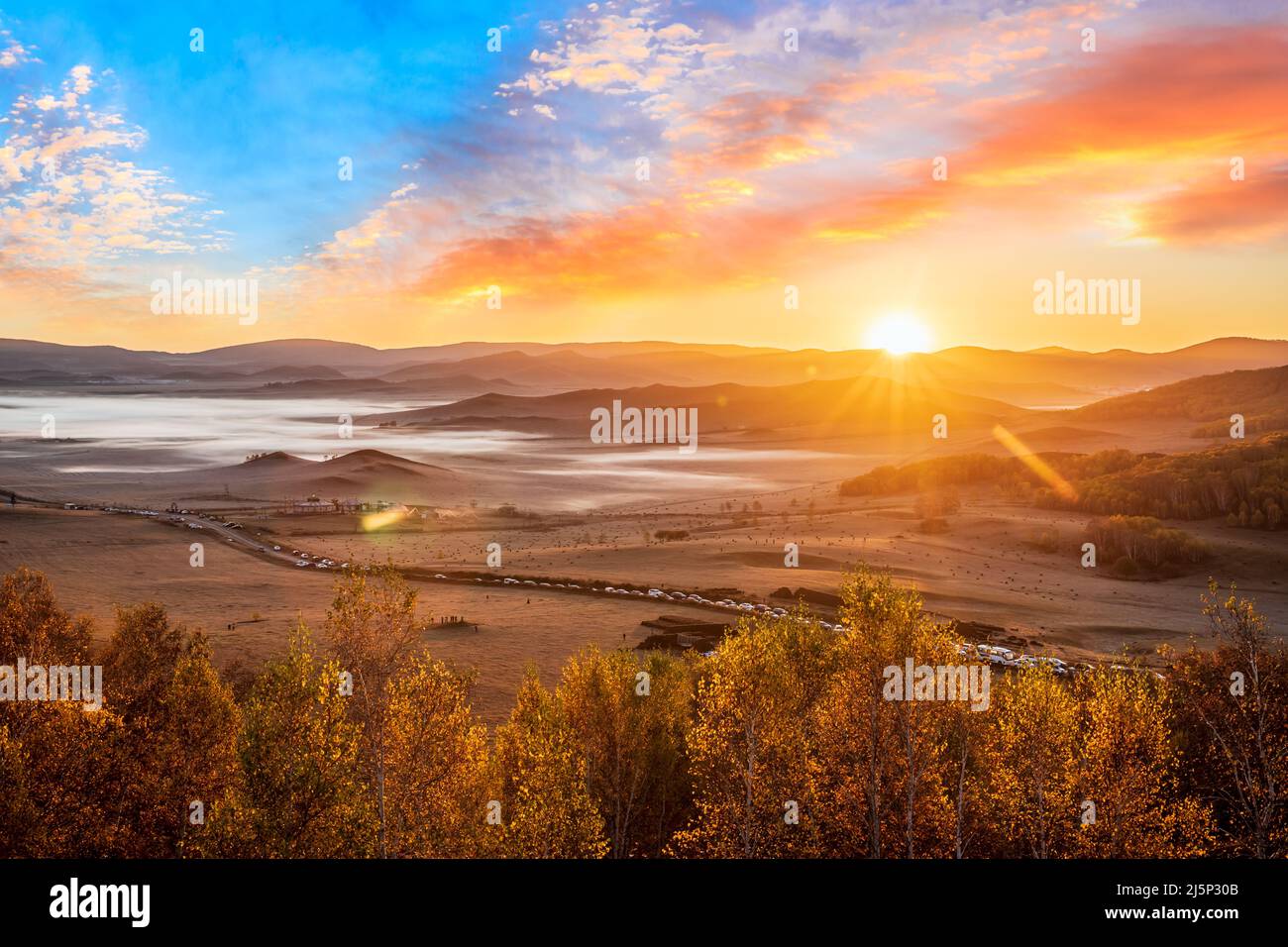 Beautiful natural landscape in Ulan Butong grassland, Inner Mongolia, China. Colorful grassland and mountain landscape in autumn season. Stock Photo