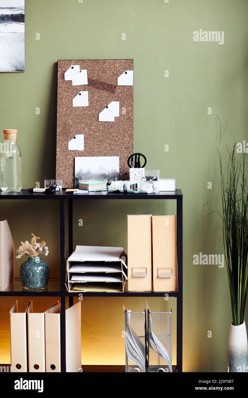 Shelves with binders, documents and sticky notes in office of psychologist Stock Photo