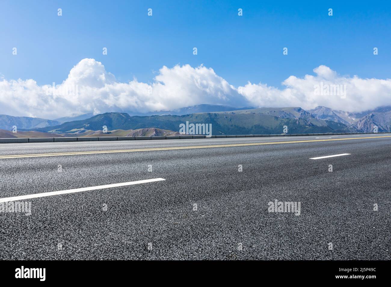 Asphalt road and mountain with sky clouds background Stock Photo - Alamy