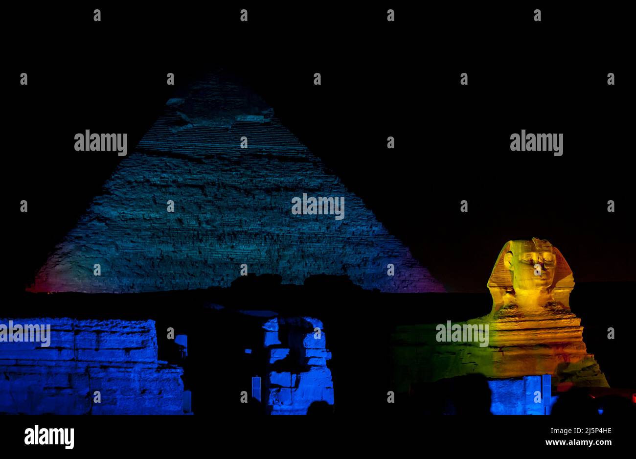 The Pyramid of Khafre and the Great Sphinx illuminated during the Pyramids Sound & Light show on the Giza plateau at Cairo in Egypt. Stock Photo