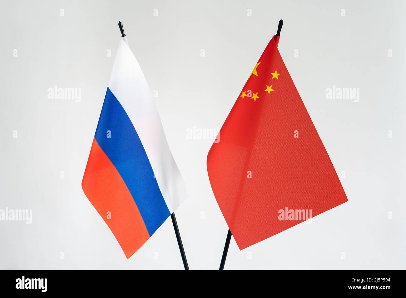 State flags of Russia and China on white background.Cooperation business alliance sanctions concept Stock Photo