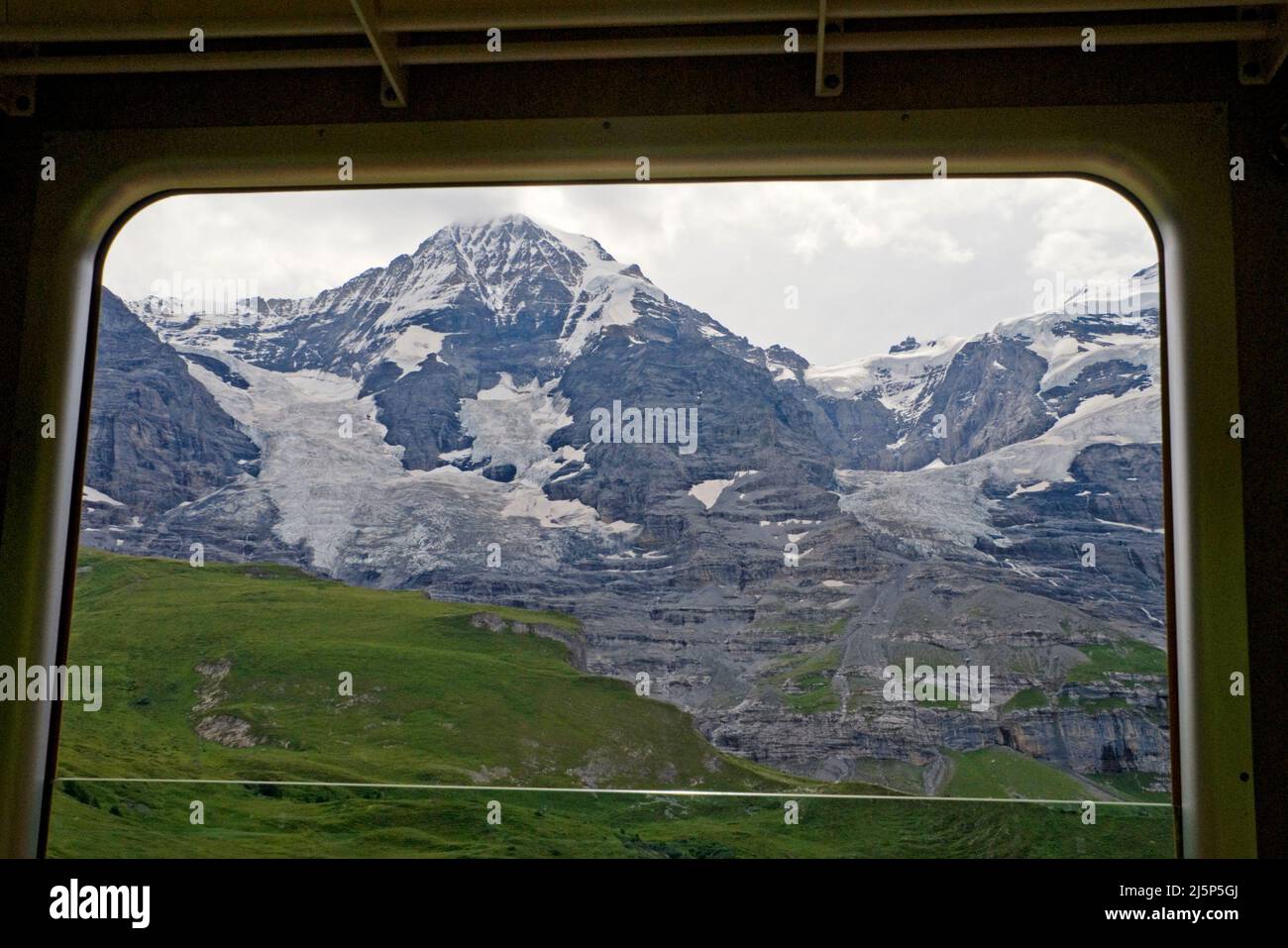 the Monch glacier from train window, Jungfrau region, Oberland bernese, Switzerland Stock Photo