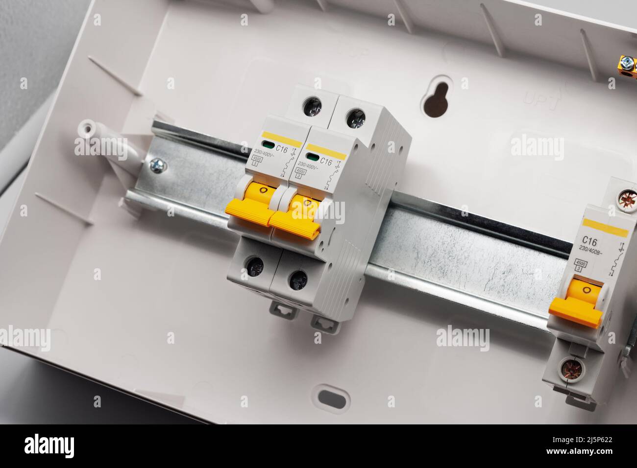 Protective electric devices on a din rail. Stock Photo