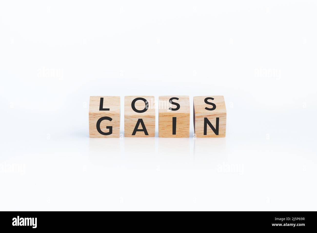 turn loss into gain concept, wooden cube with word LOSS flip to GAIN ...
