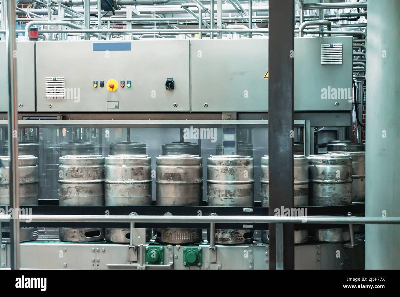 Automatic conveyor line for bottling craft beer into kegs in microbrewery. Brewery manufacturing. Stock Photo