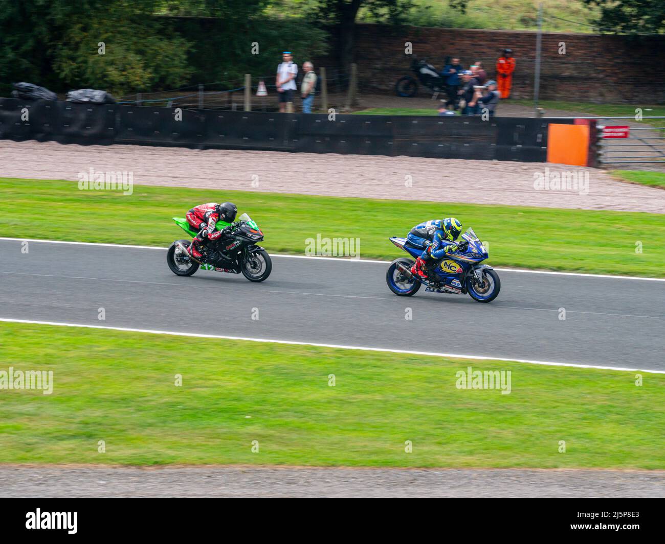 2 motorbikes racing at Oulton Park Circuit, Cheshire, UK Stock Photo