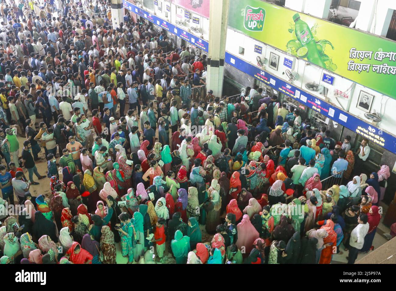 Dhaka, Bangladesh. 25th Apr, 2022. Bangladeshi people wait in queue to