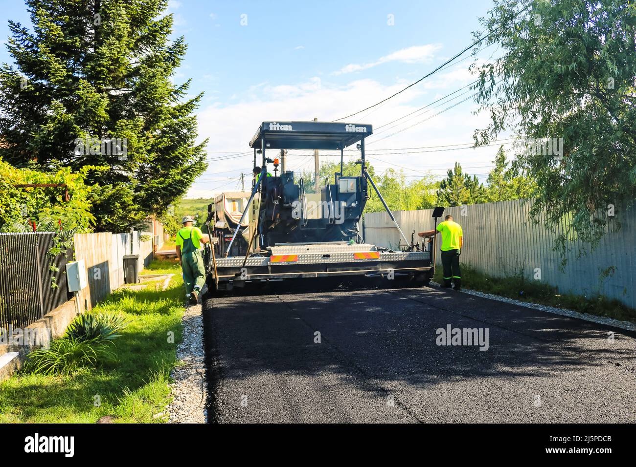 Workers and asphalting machines. Construction, asphalting of new road in  Bucharest, Romania, 2022 Stock Photo - Alamy