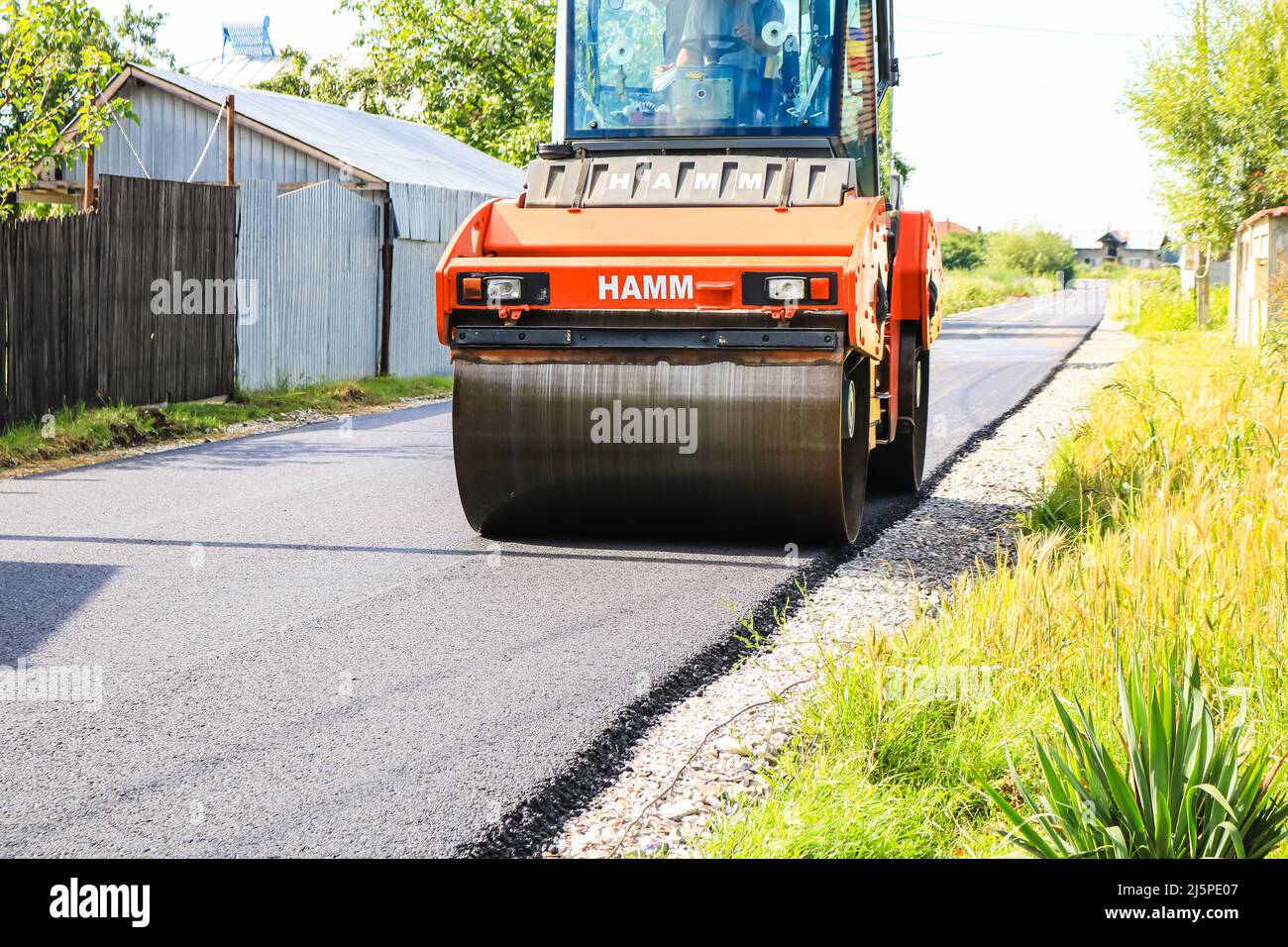 Workers and asphalting machines. Construction, asphalting of new road ...