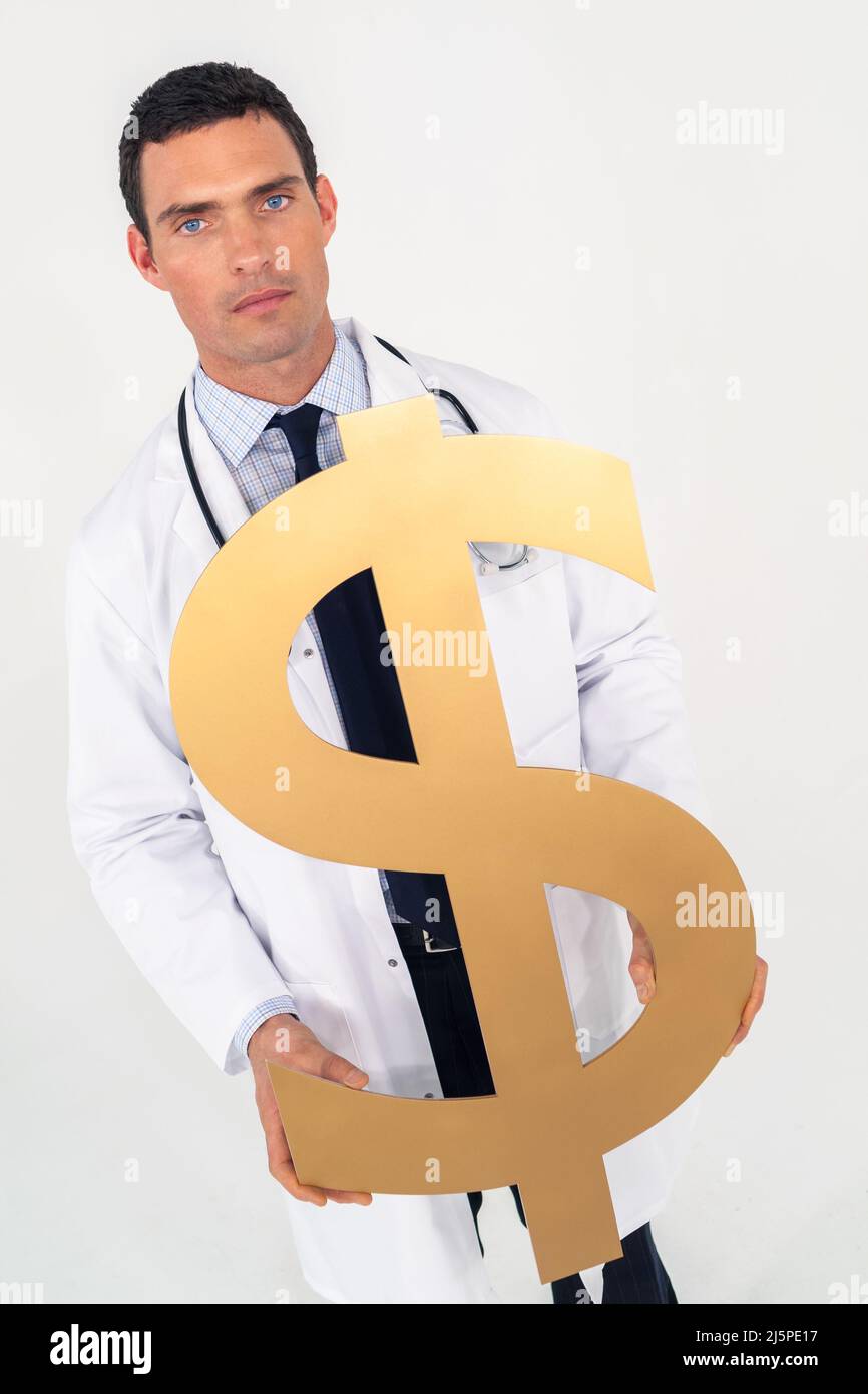 Worried concerned male doctor holding dollar sign. Cost of medical health insurance healthcare concept. Stock Photo