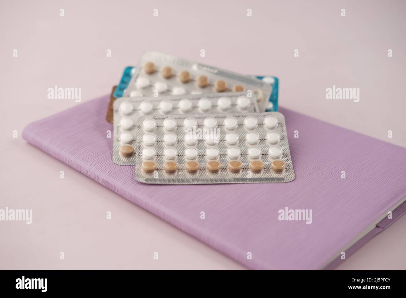 birth control pills on wooden background, close up  Stock Photo