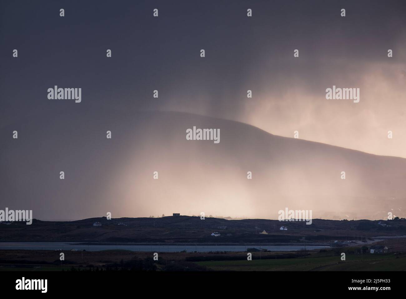 A passing storm off Achill Island seen from Ballycroy National Park, County Mayo, Ireland Stock Photo