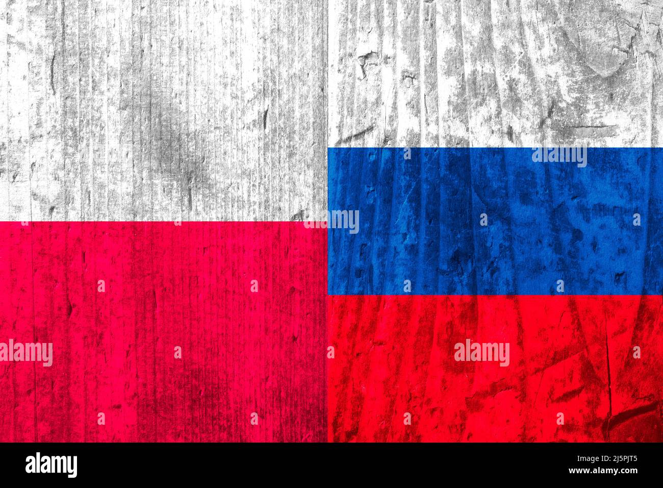 Flags of Poland and Russia on a wooden surface. Stock Photo