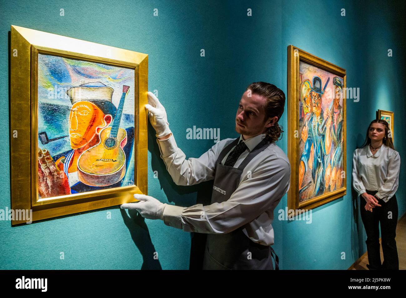 London, UK. 25th Apr, 2022. David Burliuk, Sailor and Guitar, and The Workers, 1922 - Highlights from Safeguarding the Irreplaceable: A Selling Exhibition to Benefit the Ukraine Heritage Response Fund at World Monuments Fund at Christie's, London. Credit: Guy Bell/Alamy Live News Stock Photo