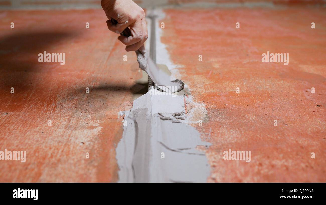 Fastening building beacons with mortar. Construction. Fixing building ...