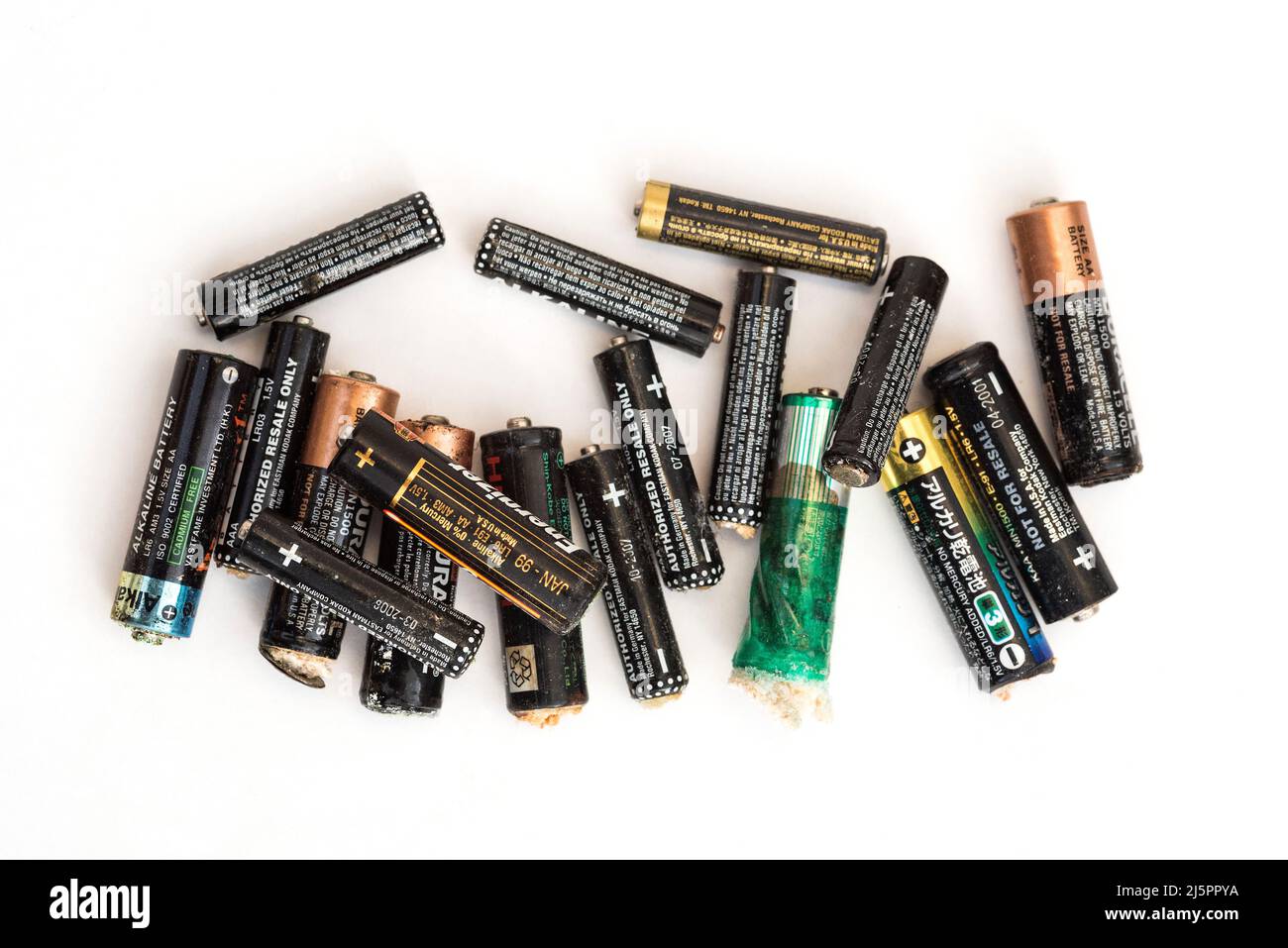 Corrosion of alkaline batteries. Environmental concern / recycling / safe disposal. Battery technology. Electric power storage. Stock Photo