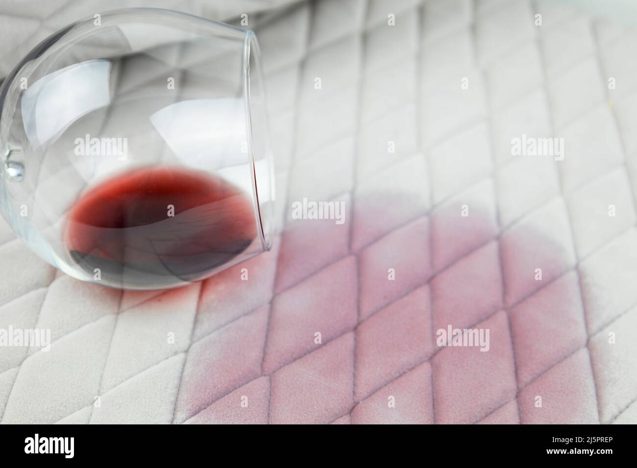 a spilled glass of wine on the tablecloth. Cleaning clothes and