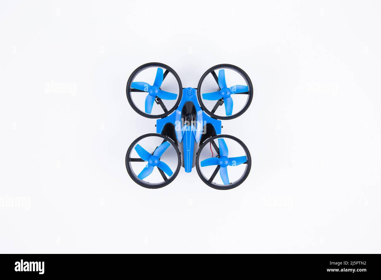 a small toy quadrocopter isolated on white background Stock Photo