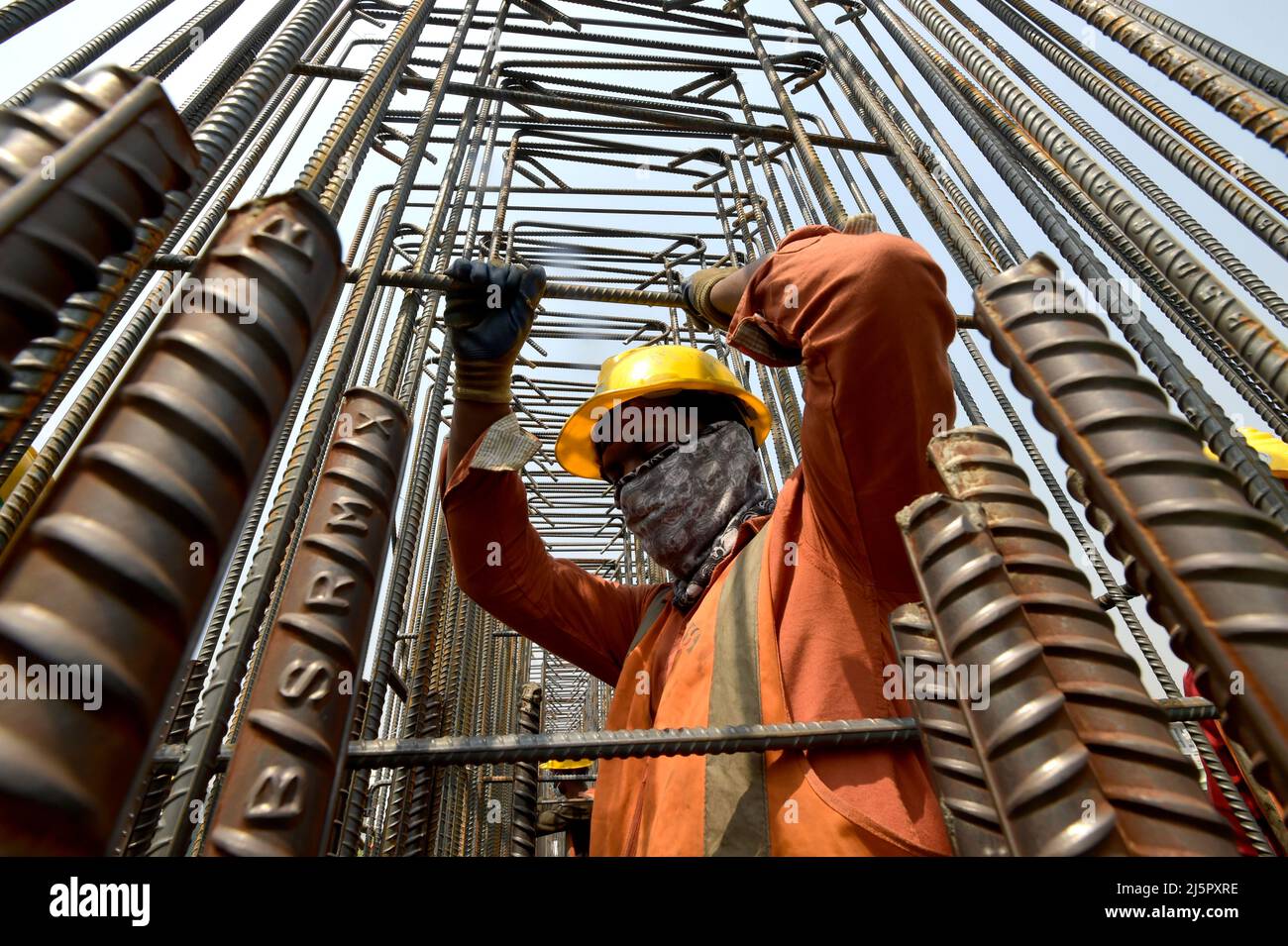 Dhaka. 25th Apr, 2022. A builder works at the construction site of the First Dhaka Elevated Expressway (FDEE) in Dhaka, Bangladesh, March 17, 2022. TO GO WITH 'Feature: Fast and safe, Sino-Bangladeshi expressway joint venture sees clear road ahead' Credit: Xinhua/Alamy Live News Stock Photo