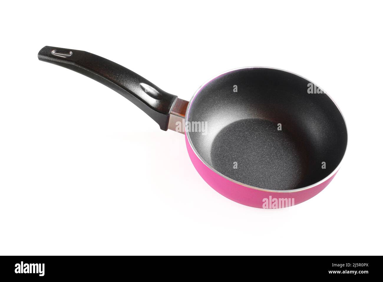Small pink saucepan with black handle isolated on white background. Empty kitchen utensil Stock Photo