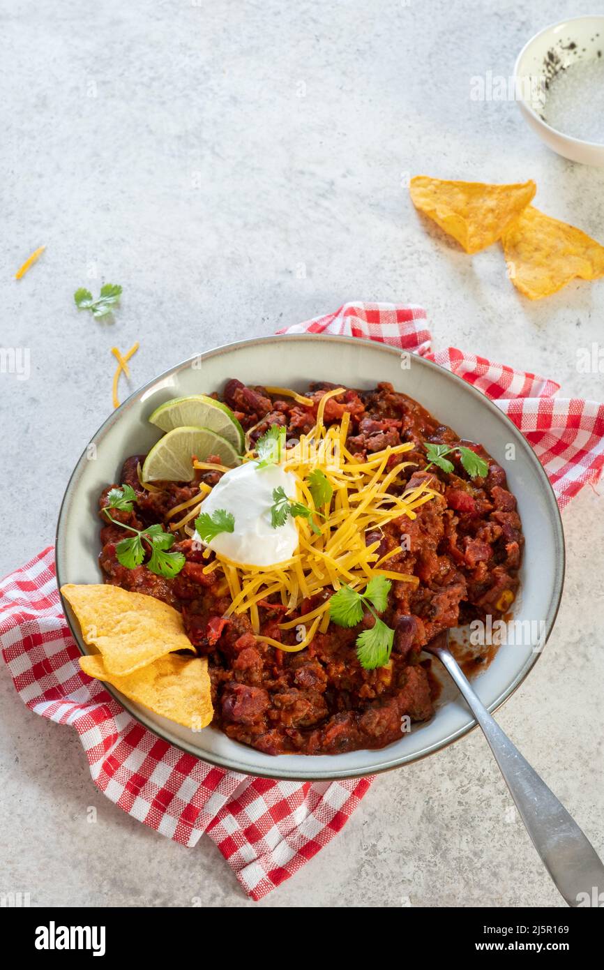 Chili con carne - traditional mexican minced meat and vegetables stew in tomato sauce Stock Photo