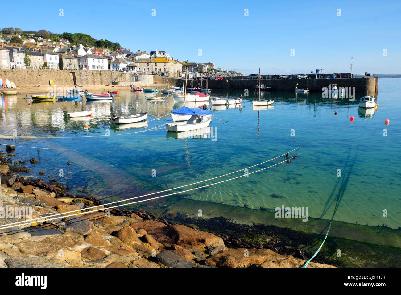 Boats in the picturesque fishing village of Mousehole in Cornwall