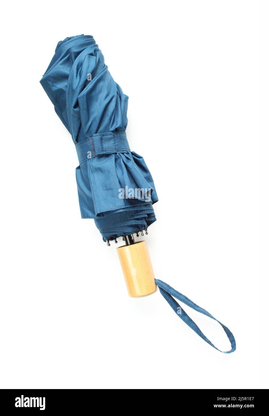 Small blue umbrella folded on white background Stock Photo Alamy