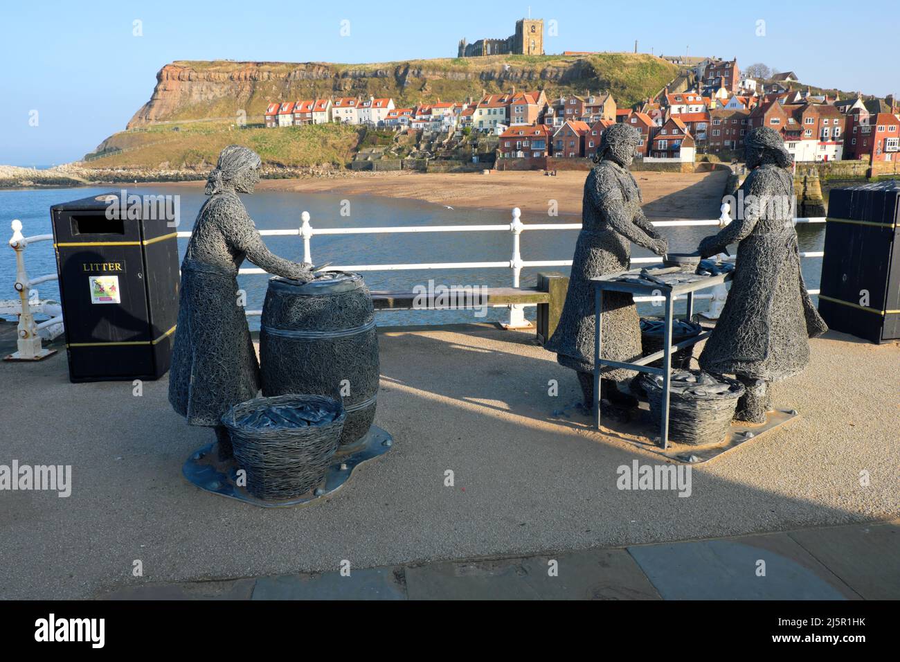 The Herring Girls Sculpture by Emma Stothard with a view across the