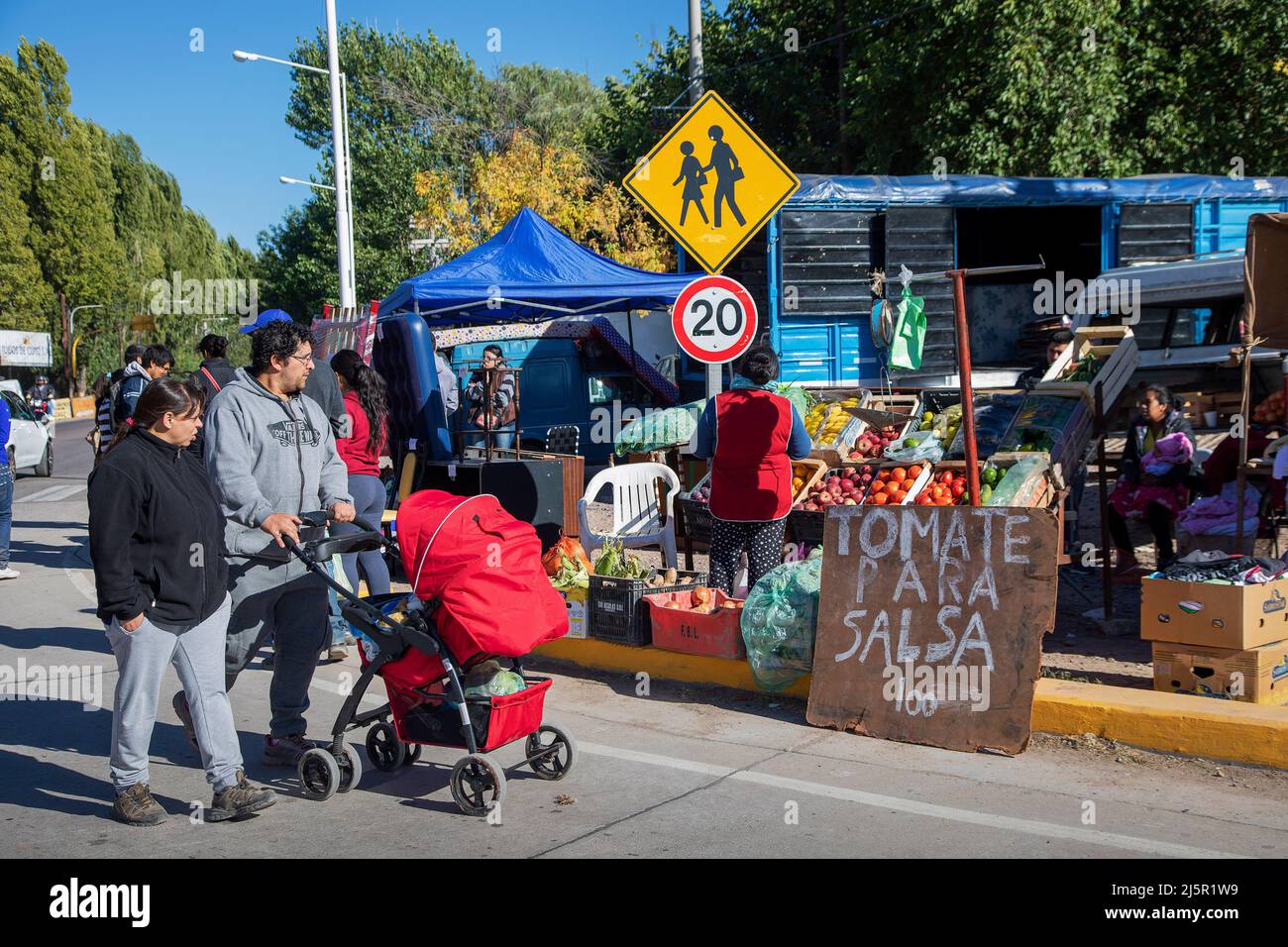 Argentina, Uco valley - indian couple with their baby is walking on a weekly streetmarket. Stock Photo
