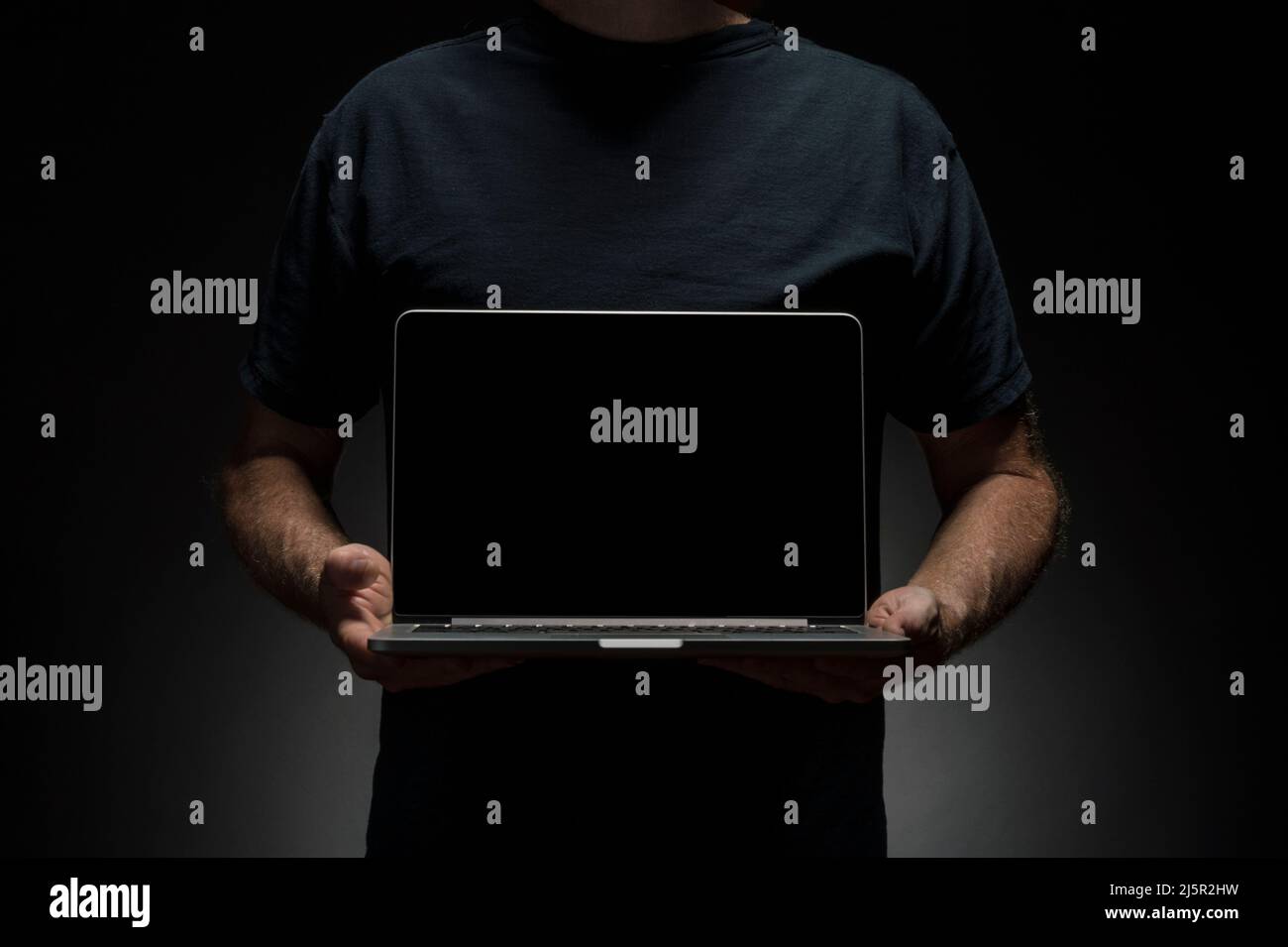 Man holding laptop Stock Photo