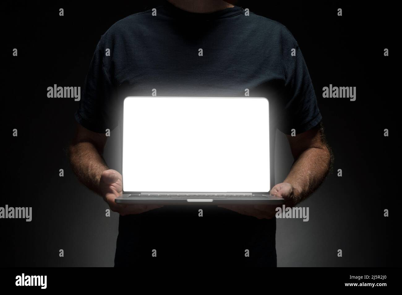 Man holding laptop Stock Photo