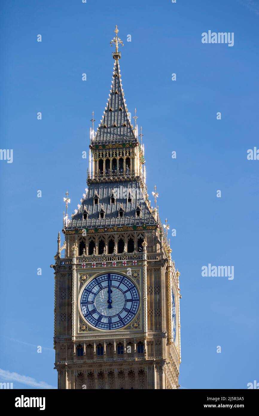 Clock arms are seen at 12 o’clock on a clock face of Big Ben, Elizabeth Tower, in Westminster, central London. Stock Photo
