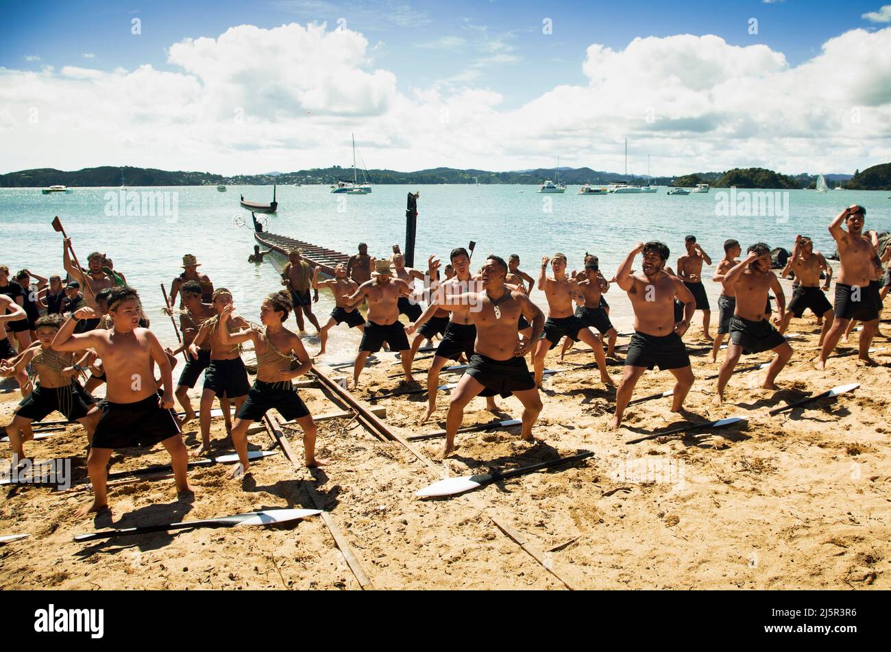 The haka is a traditional war cry, war dance, or challenge in Māori culture. On the photo it is performed during Waitingi day. Waitangi Day is the nat Stock Photo