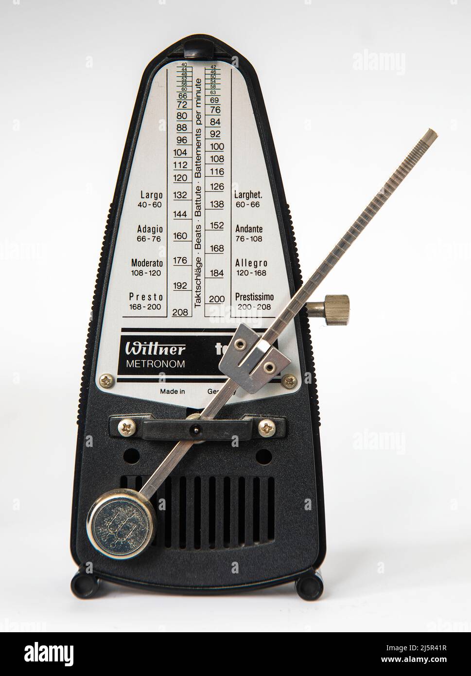 A metronome is a device that produces an audible click or other sound at a regular interval that can be set by the user, typically in beats per minute Stock Photo