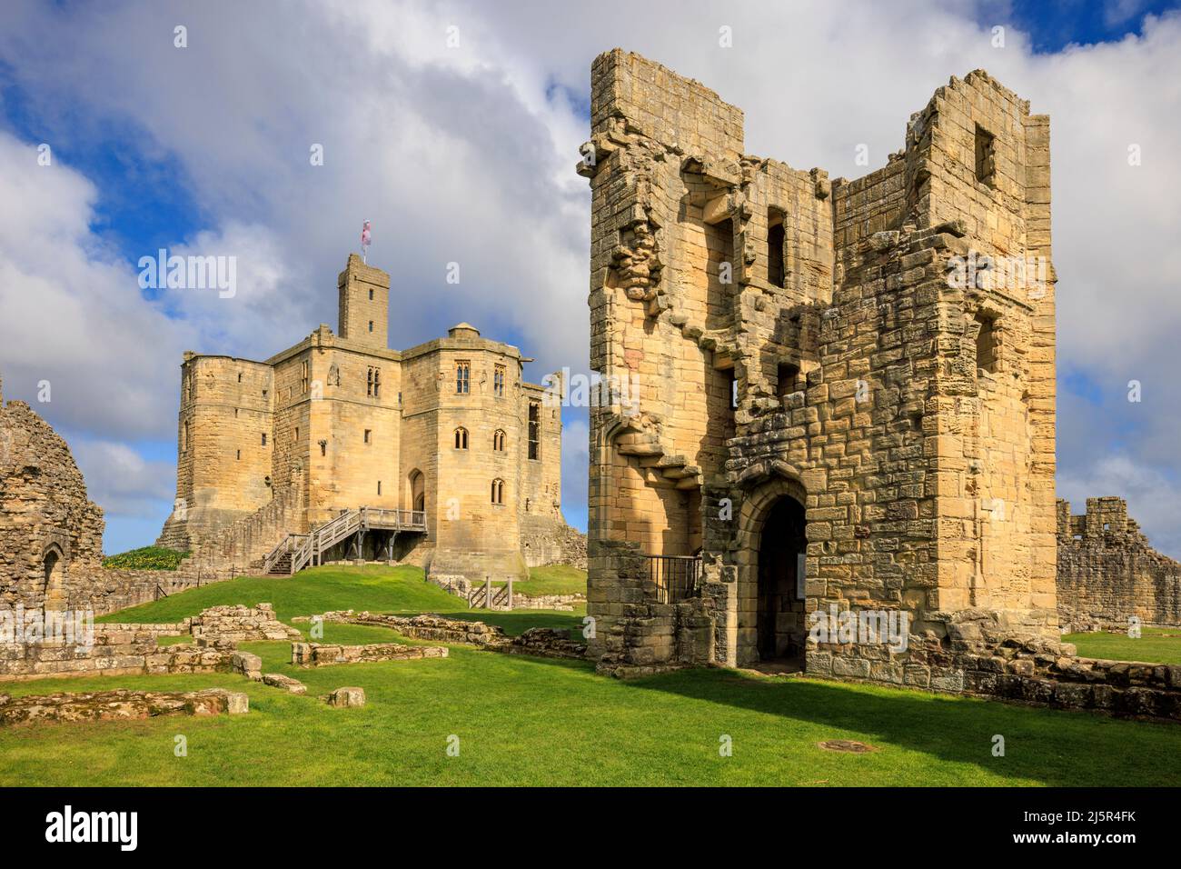The Keep and ruined Lion Tower of Warkworth Castle on the Northumberland Coast Path, Northumberland, England Stock Photo