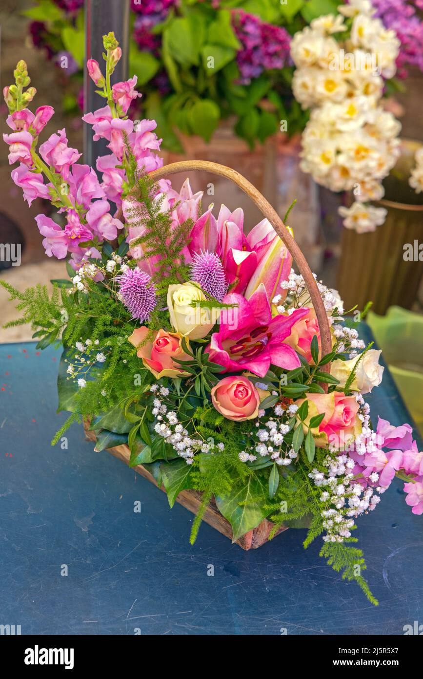 Beautiful Fresh Flowers Arrangement in Basket Spring Decor Stock Photo
