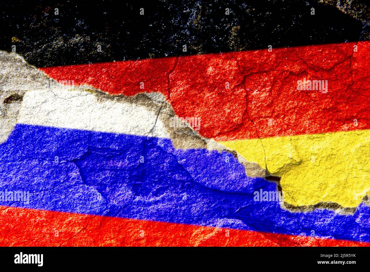 Flags Of Germany And Russia On Broken Ground Stock Photo