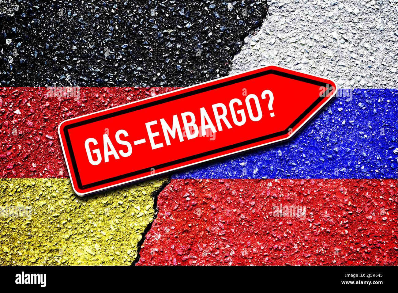 Flags Of Germany And Russia On Broken Ground, Signpost Gas Embargo Stock Photo